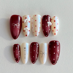 Embrace your "Red" era with the "Retro Femininity" handmade press-on nail set. Featuring bold jam-red tones, pearly iridescent ivory, and hand-painted polka dots, these nails are inspired by classic vintage glamour. Durable, confident, and salon-quality. Shop the ultimate retro manicure!