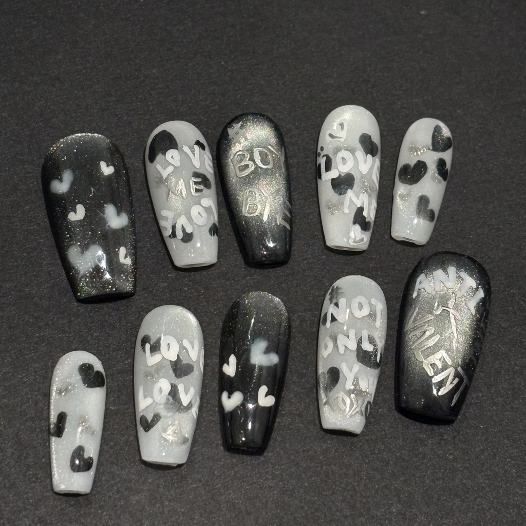 Handmade black and silver magnetic press-on nails with "Anti-Valent" and "Boy Bye" hand-painted lettering.