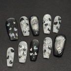 Handmade black and silver magnetic press-on nails with "Anti-Valent" and "Boy Bye" hand-painted lettering.