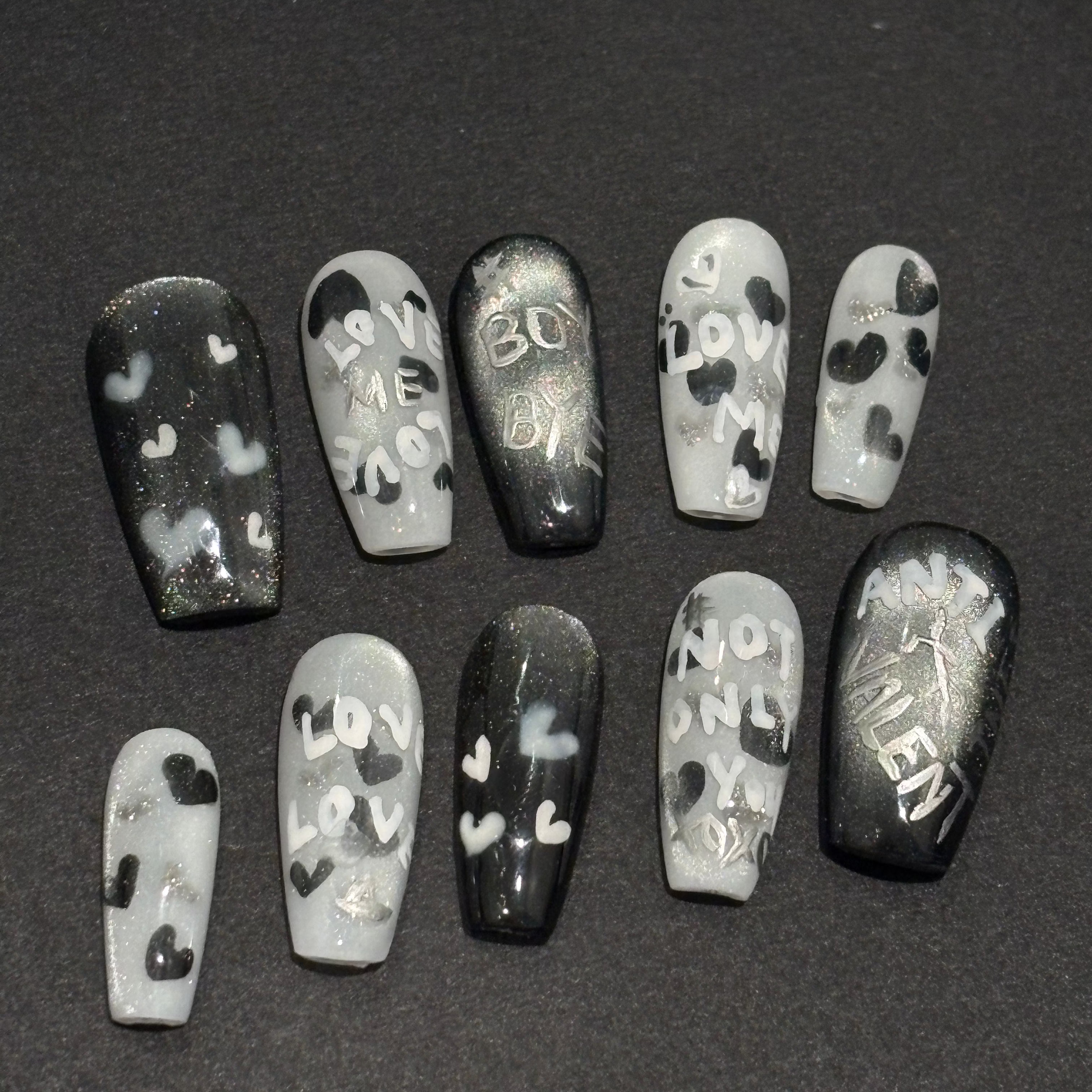 Handmade black and silver magnetic press-on nails with "Anti-Valent" and "Boy Bye" hand-painted lettering.