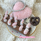Pink marble handmade press-on nails with holographic glitter heart designs.