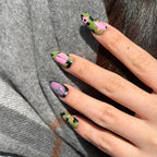 Close-up of iridescent purple shimmer and hand-painted star motifs on a BTS-inspired fan support nail set. camouflage 