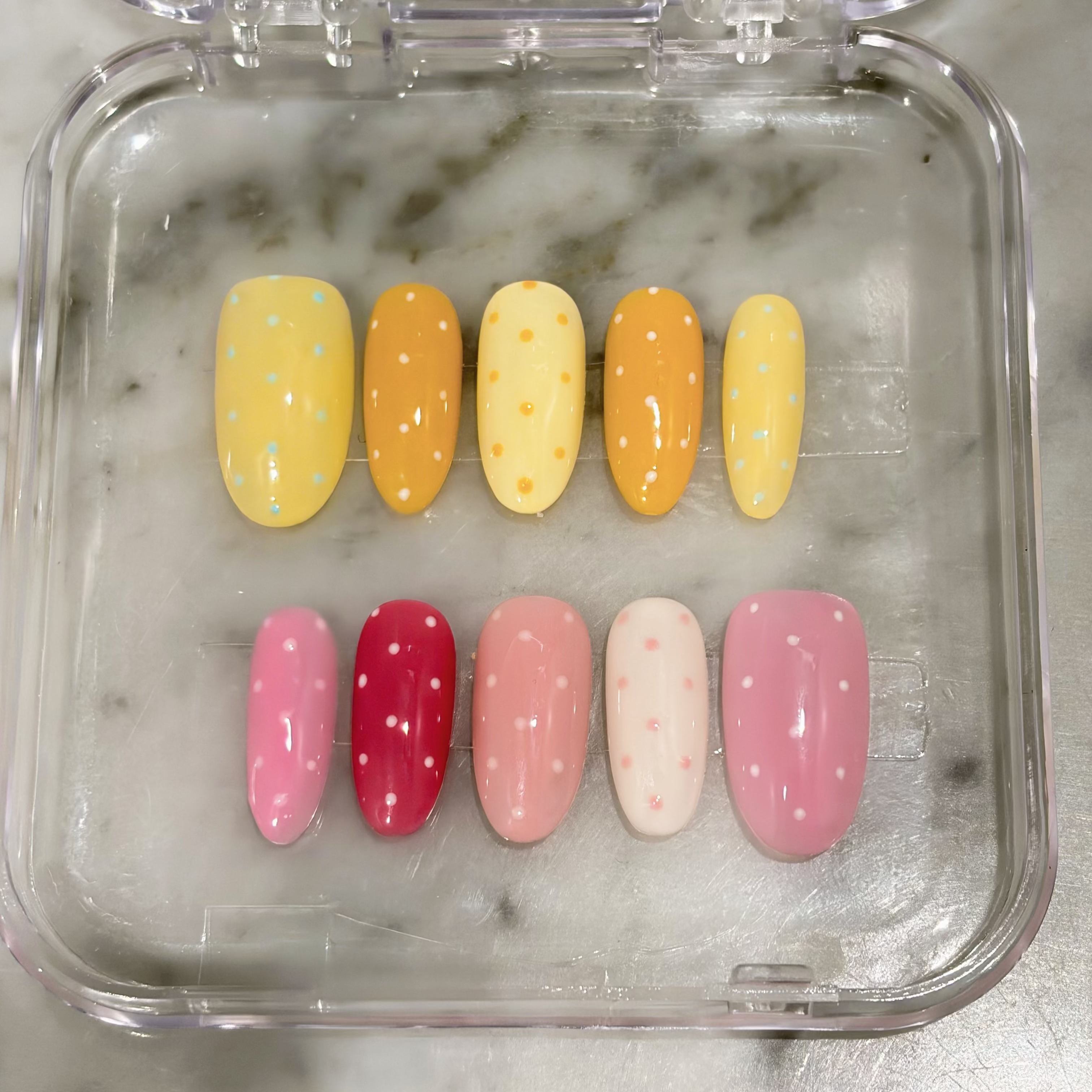 Discover "Macaron Sprinkle"—handmade press-on nails featuring a soft pastel base in macaron colors and delicate micro polka dot art. These reusable, salon-quality gel nails offer a clean, joyful, and effortless daily look for spring and summer. Custom-fit and polished.