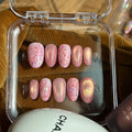 Handmade pink magnetic cat-eye press-on nails with a large 3D white velvet bow and a full micro-pearl pavé accent nail.