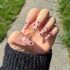 Close-up of the gold-toned hardware, Swarovski crystal embellishments, and high-shine sapphire rhinestones.