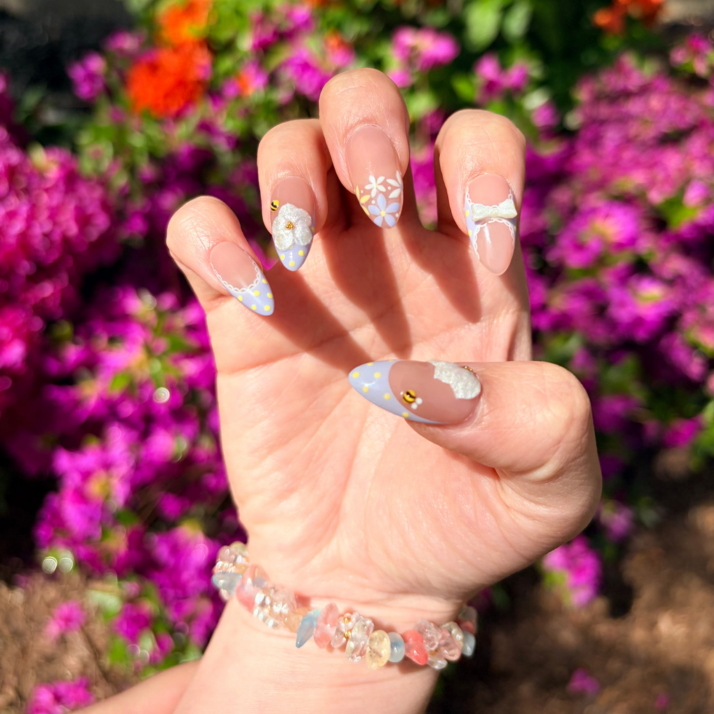 Reusable lavender flower nails, custom 3D bow press-ons, handmade honeybee gel nails, unique pastel garden manicure.
