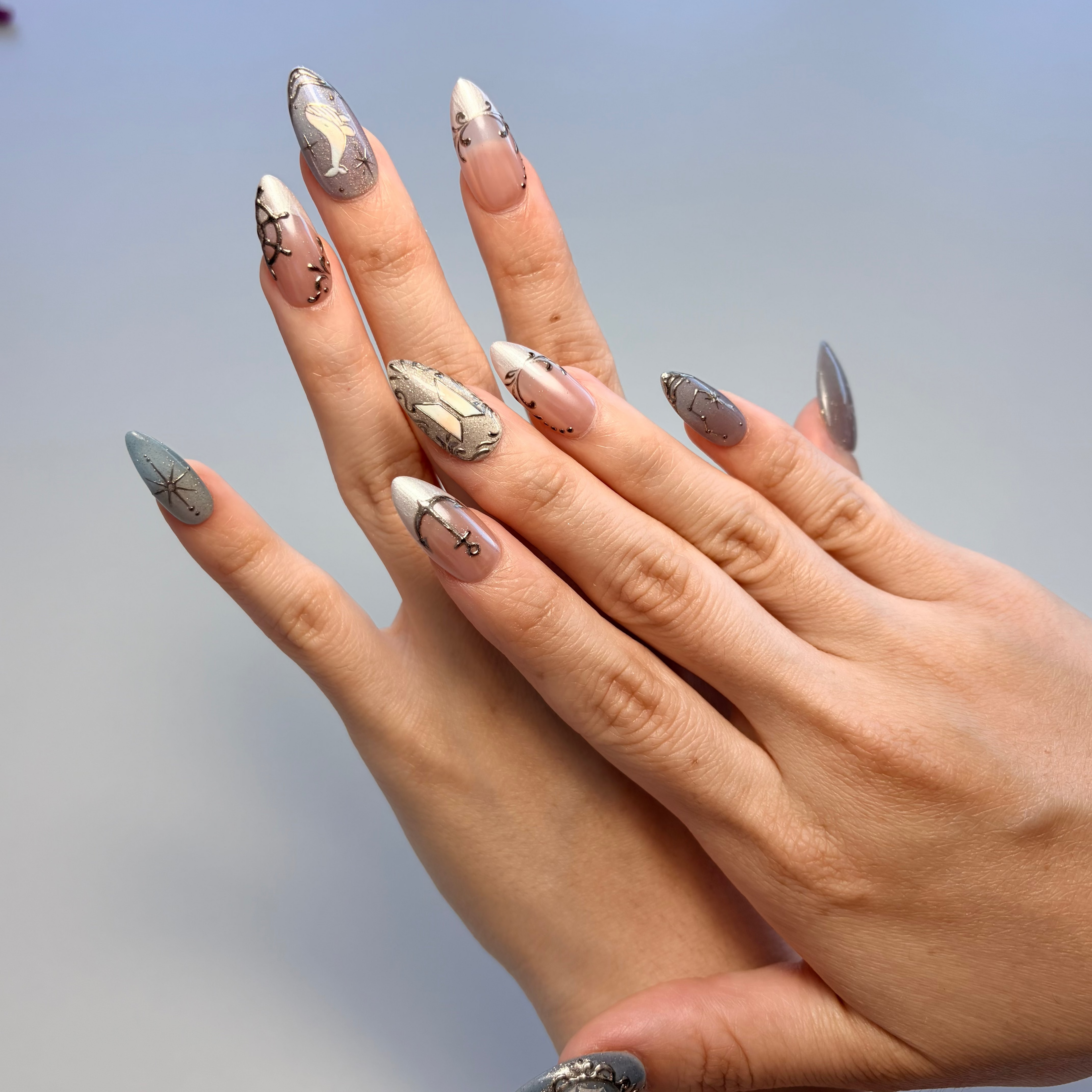 Dive into the "Seven Seas" from our BTS Collection. These handmade luxury press-on nails feature 3D whale art, chrome nautical symbols, and the BTS logo over a shimmering galactic base. The ultimate artisan set for ARMY.