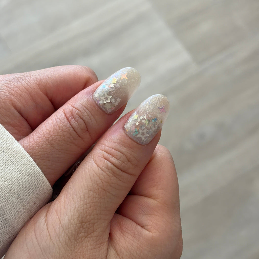 Reusable Swarovski nails, custom celestial press-ons, handmade luxury crystal nails, iridescent star gel nails.