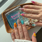 Real person wearing Tropical Press-On Nails, 3D Hibiscus Nails, Seashell Nail Art, Mermaid core Nails, Vacation Press-Ons.