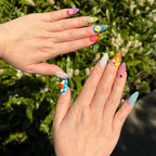 Bring the ocean to your fingertips with "Ocean Dip"—a maximalist press-on nail set featuring 3D waves, sea life, swimmers, and beach icons. These handmade, reusable gel nails are the ultimate accessory for your beach vacation. Custom-fit and vibrant.